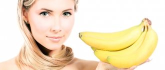 girl holding bananas in her hand on a white background