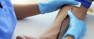 A nurse takes blood for analysis through a vein