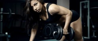 Athletic girl in dark clothes performs dumbbell rows in the gym