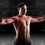 Exercises with a spring expander for men: pumping up the pectoral muscles and shoulder girdle
