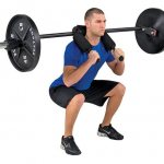 Performing Hatfield squats with a safety bar